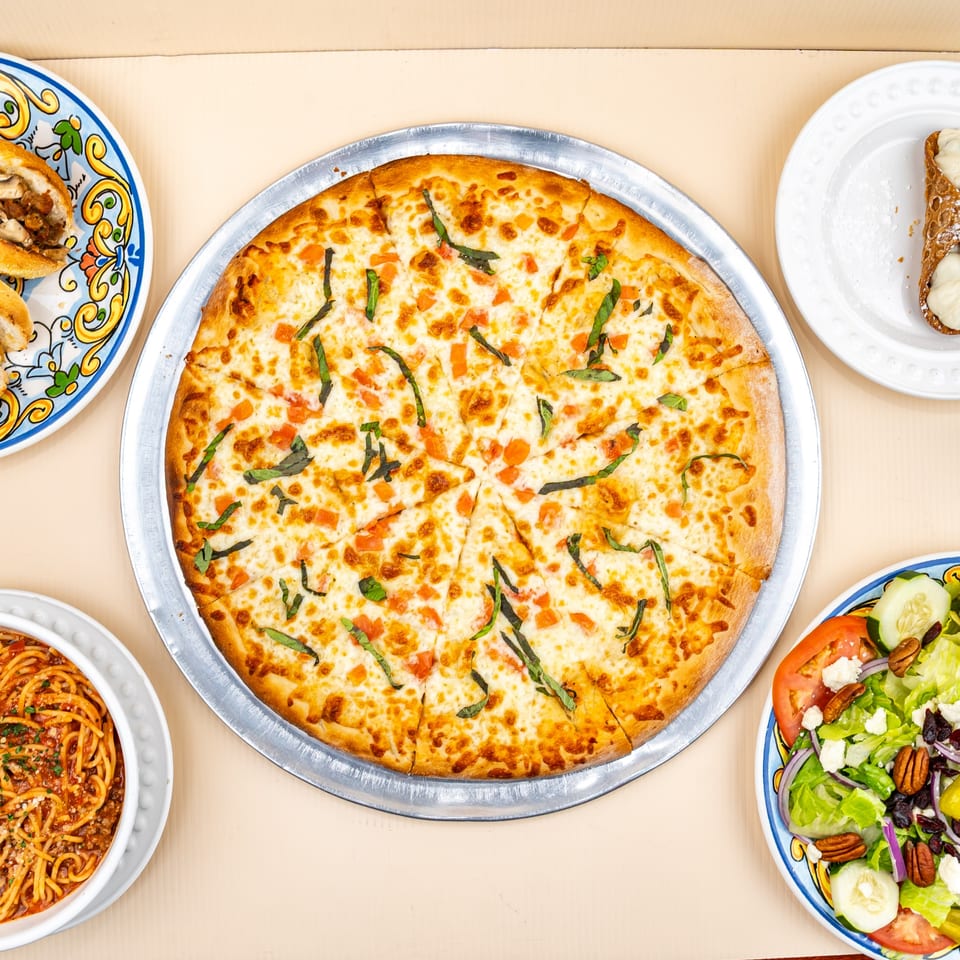 All Star Pizza & Italian Restaurant's pizza, spaghetti, salad, cannoli, and chicken roll.